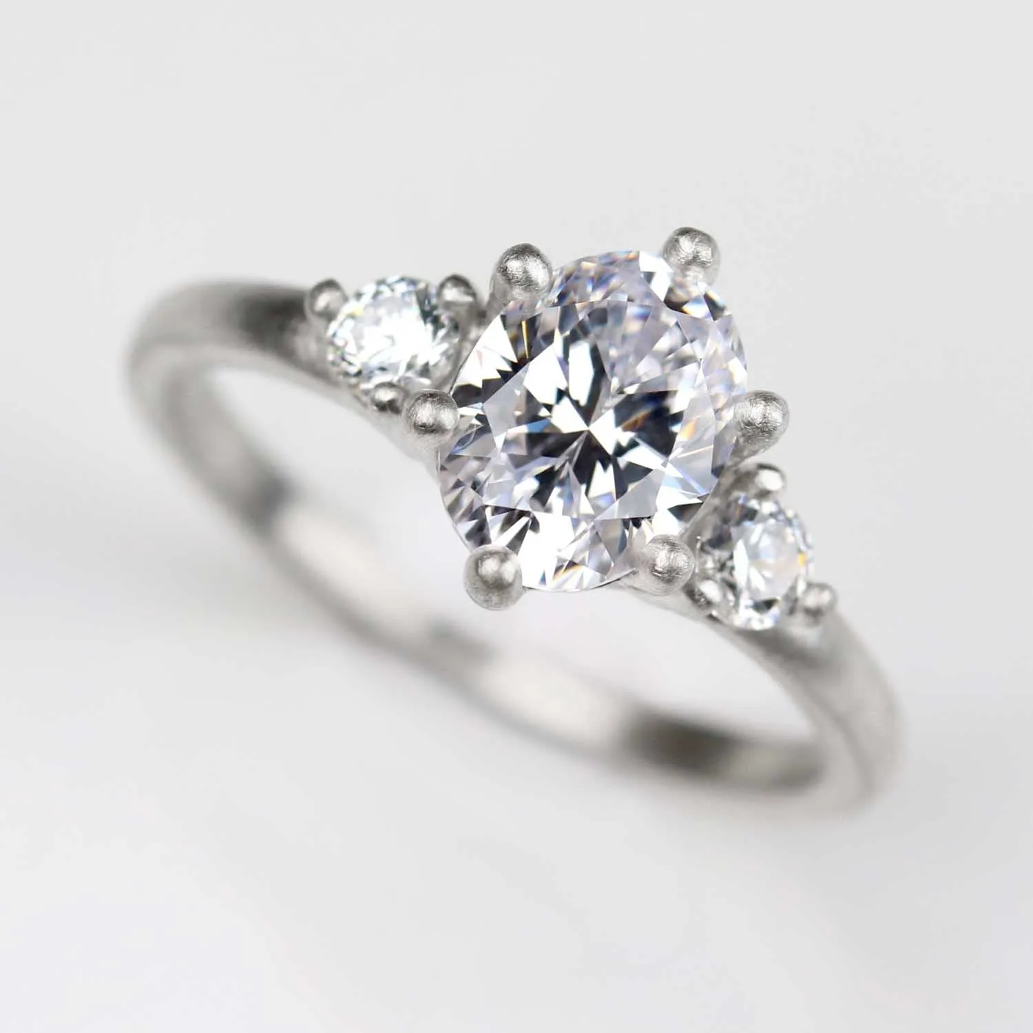 8x6mm Prong-set Oval Three Stone Ring •