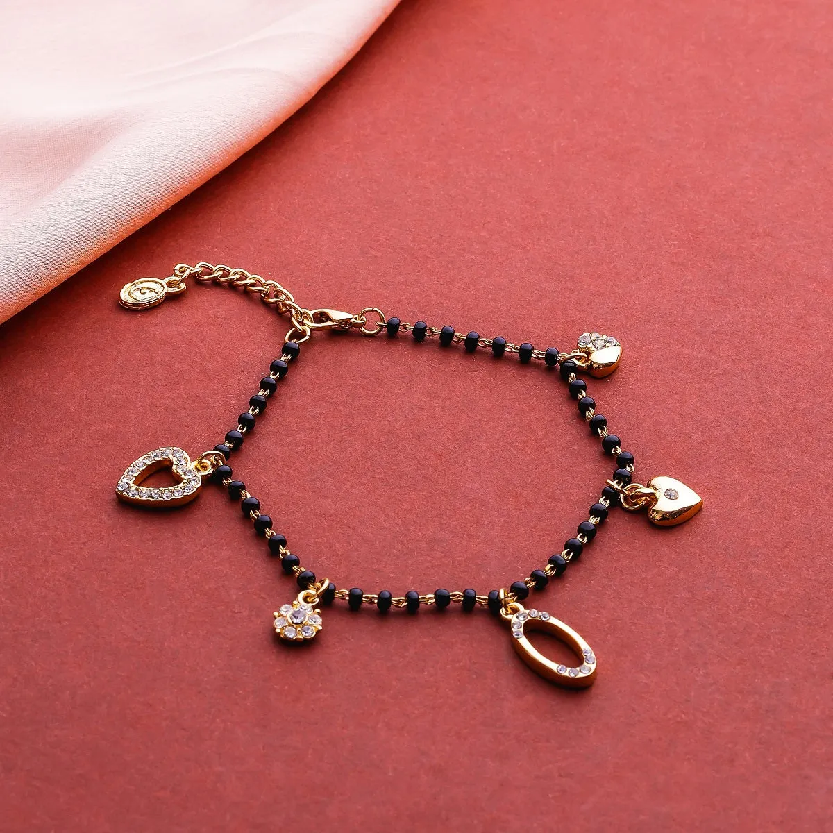 Estele Gold Plated Florat Heart Loop Shaped Black Beads Bracelet with Austrian Crystals for Women